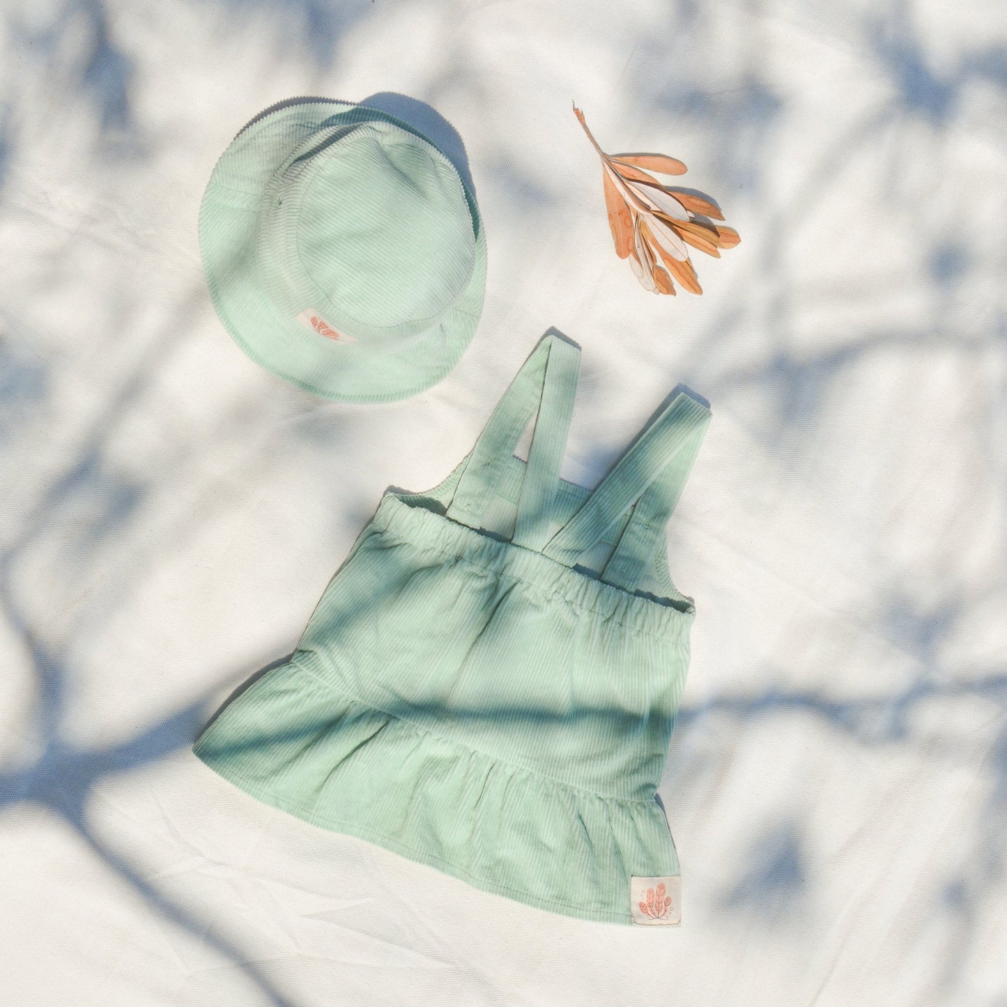 Gots certified organic cotton, ethical and sustainable fashion for babies and toddler, ocean green, reef-friendly fashion, Australian small business, corduroy for babies, baby toddler corduroy dress, retro dress, button dress with pockets