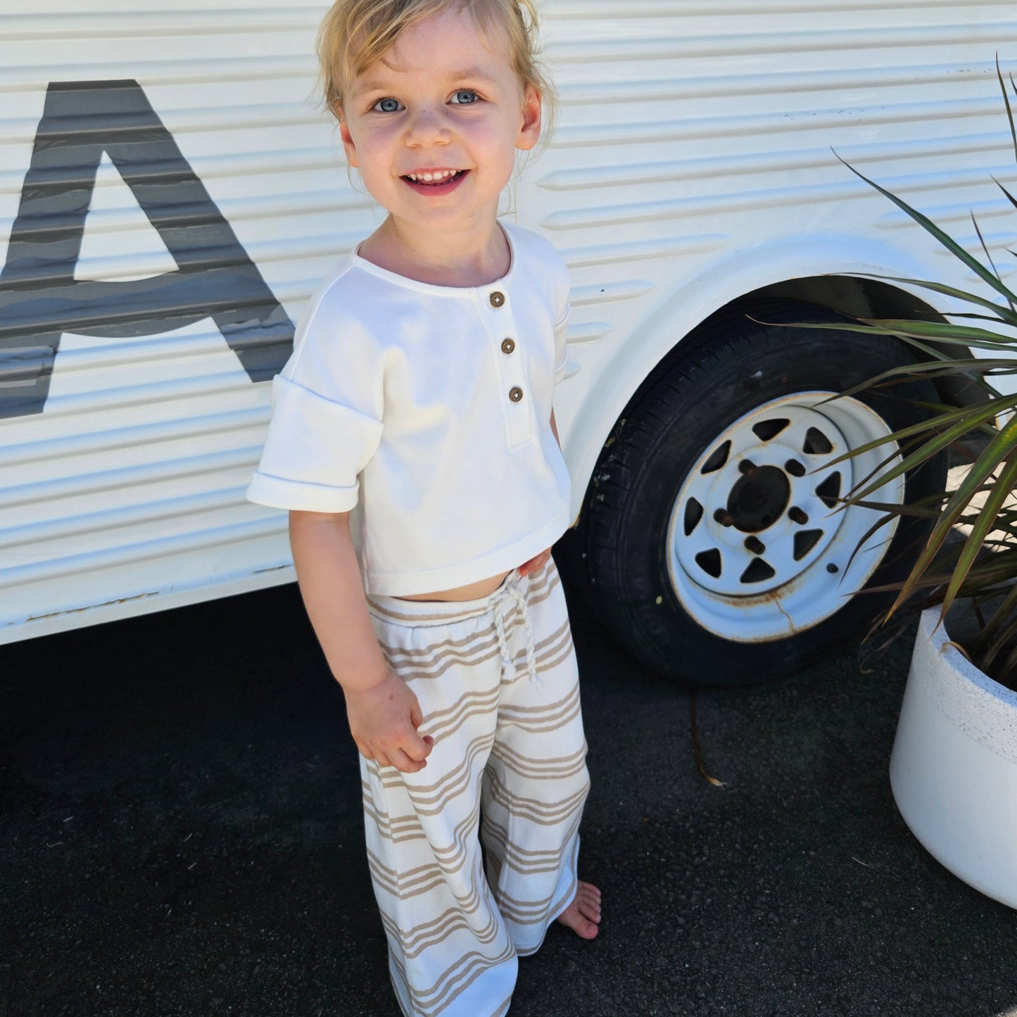 Gots certified organic cotton, ethical and sustainable fashion for babies and toddler, reef-friendly fashion, gender neutral, Australian small business, corduroy for babies, toddler pants, pants for tall baby, pants for toddler with long legs, green reef co, minimalistic fashion, capsule wardrobe for toddler, summer capsule, stripe pants for boys and girls alike, flare pants for toddlers, flare pants for babies