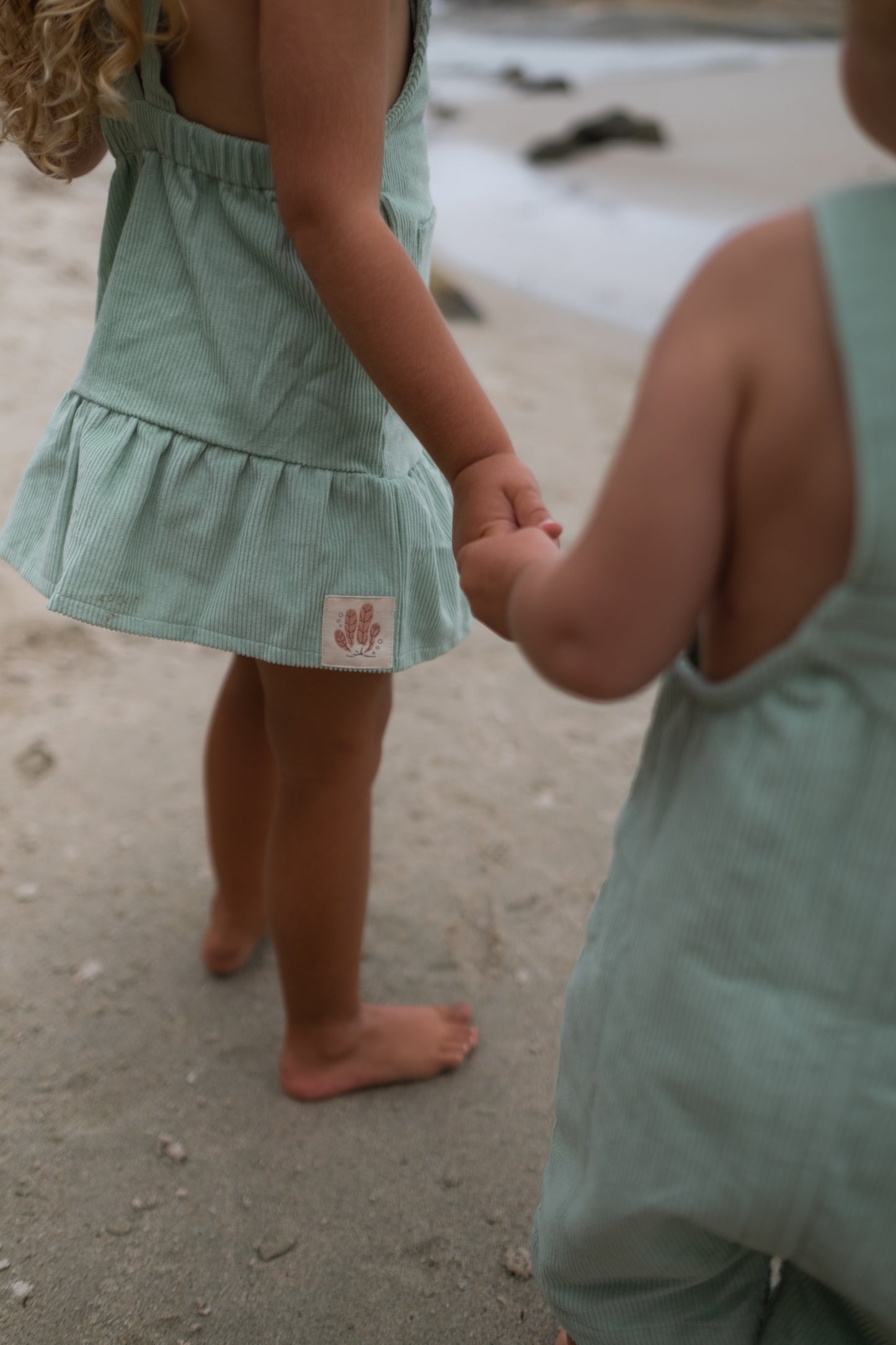 Gots certified organic cotton, ethical and sustainable fashion for babies and toddler, ocean green, reef-friendly fashion, Australian small business, corduroy for babies, baby toddler corduroy dress, retro dress, button dress with pockets