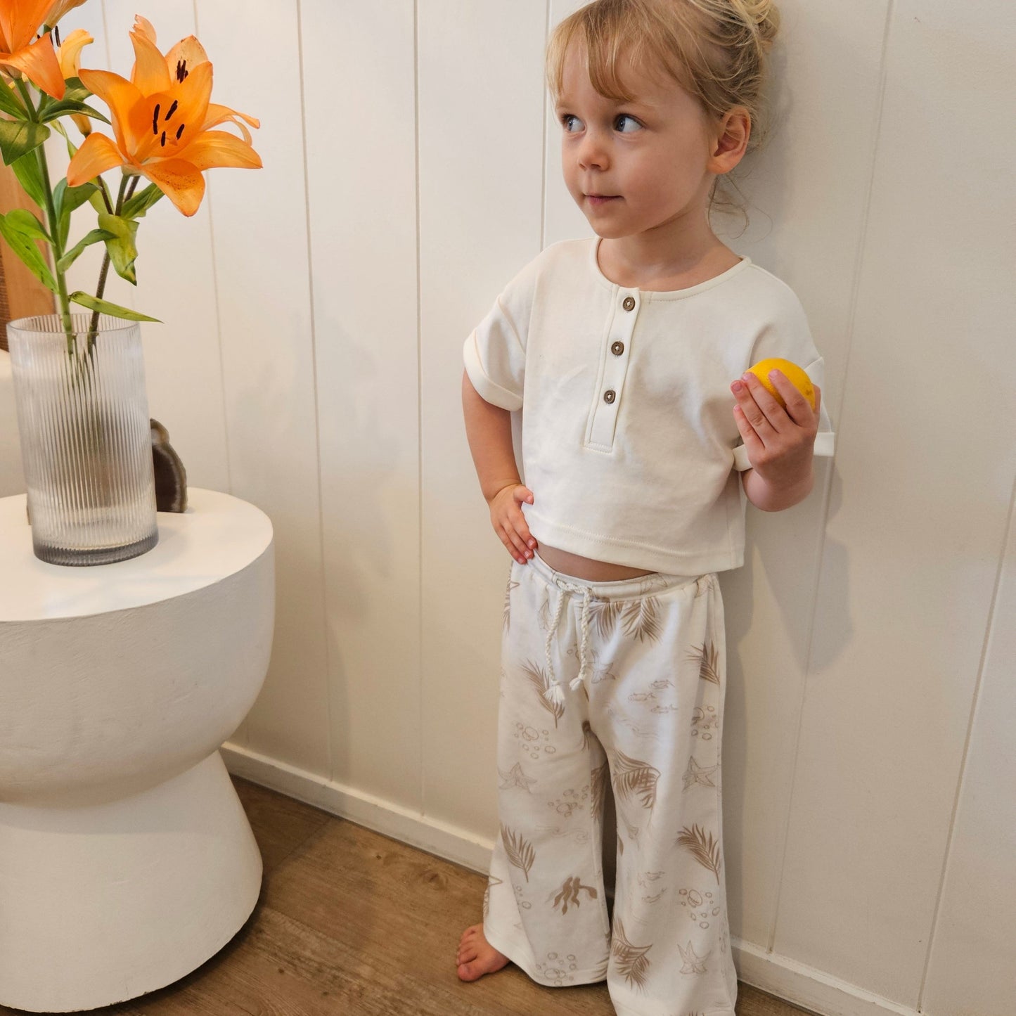Gots certified organic cotton, ethical and sustainable fashion for babies and toddler, reef-friendly fashion, gender neutral, Australian small business, corduroy for babies, toddler pants, pants for tall baby, pants for toddler with long legs, green reef co, minimalistic fashion, capsule wardrobe for toddler, summer capsule, stripe pants for boys and girls alike, flare pants for toddlers, flare pants for babies