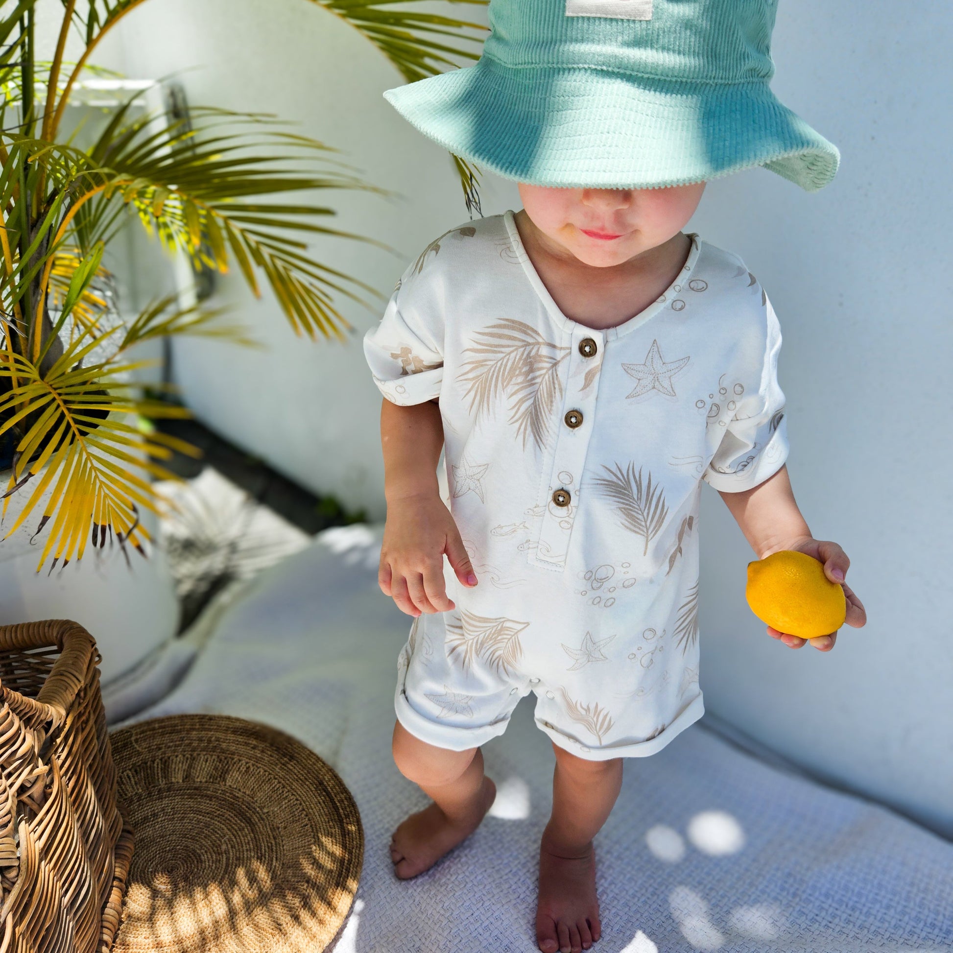Gots certified organic cotton, ethical and sustainable fashion for babies and toddler, reef-friendly fashion, gender neutral, Australian small business , green reef co, minimalistic fashion, capsule wardrobe for toddler, summer capsule, baby romper with stripes and reef prints, lightweight, breathable cotton