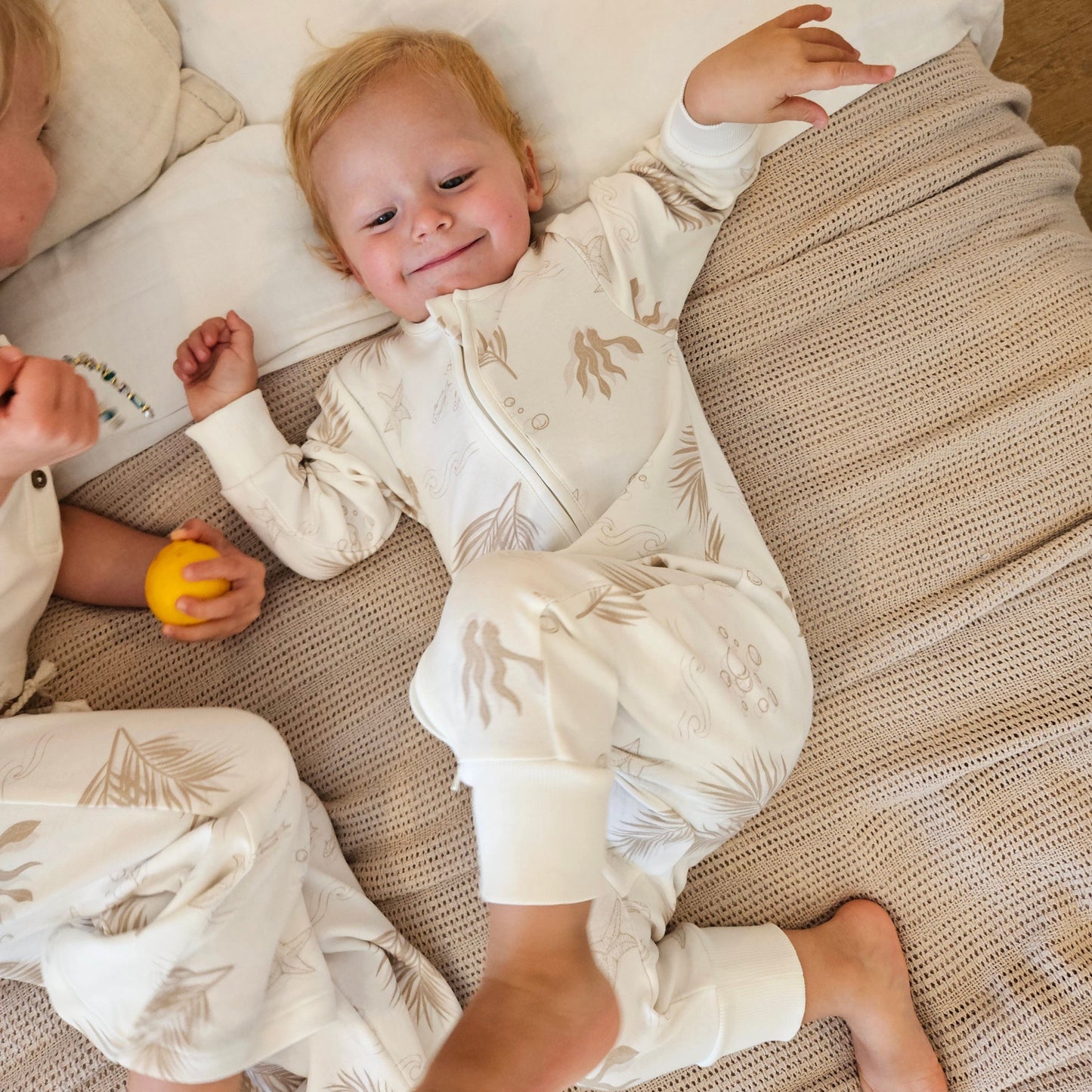 Gots certified organic cotton, ethical and sustainable fashion for babies and toddler, gender neutral, reef-friendly fashion, Australian small business , green reef co, minimalistic fashion, capsule wardrobe for toddler, summer capsule, baby romper with stripes and reef prints, lightweight, breathable cotton, organic cotton zip suit, growsuit for, romper for babies